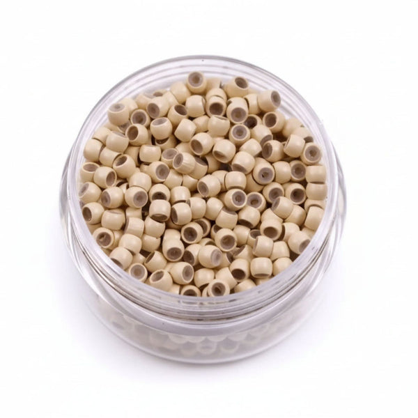 Clear container filled with blonde hair beads on a white background