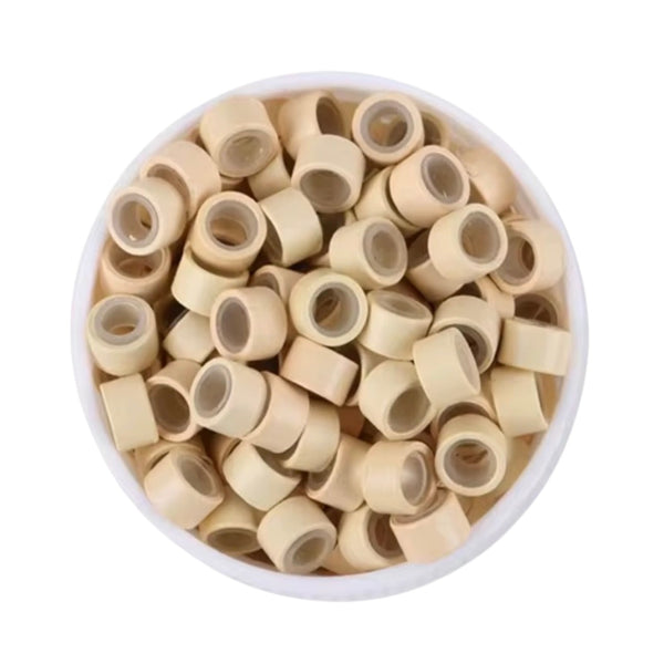 Blonde #13 5mm size hair beads in a white bowl on a white background