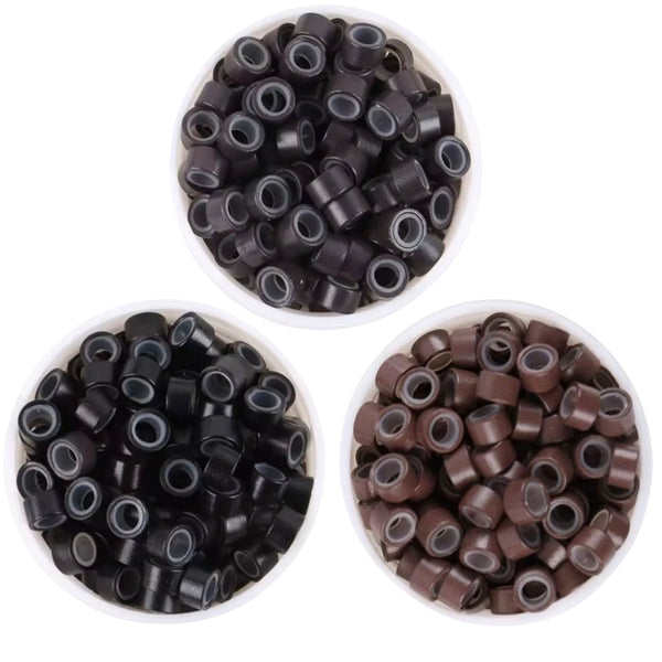 5mm size hair extension beads in bowls containing colours black and brown  and dark brown beads on a white background