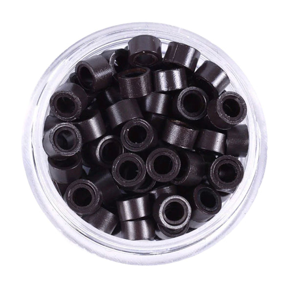 Clear container filled with black 5mms size hair extension beads on a white background