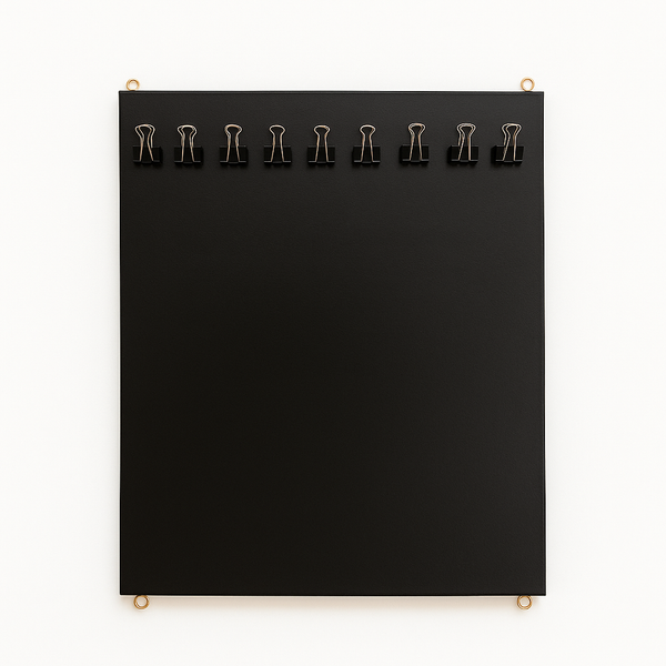 Black board vertical with clips on a white background