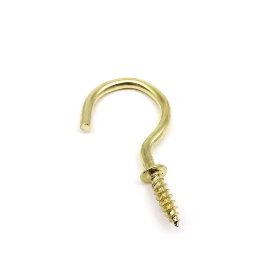 Gold metal hook on a white background