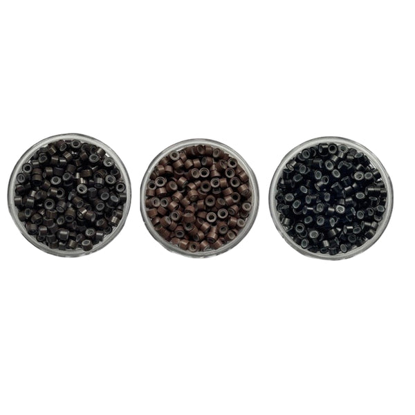 Three round containers filled with dark brown, brown and black beads on a white background