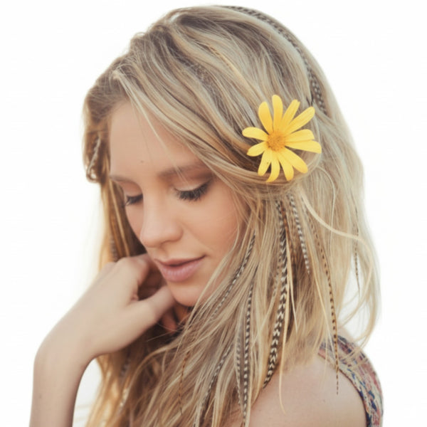 Woman with a yellow flower and natural feather hair extensions in her hair on a white background