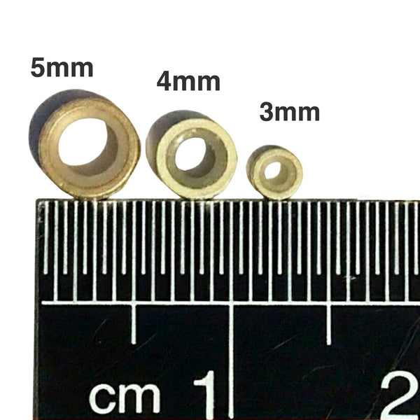 Comparison of silicone-lined beads with a ruler for size measurement.