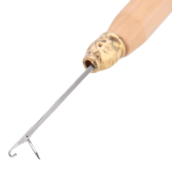 Metal tool with wooden handle on a white background