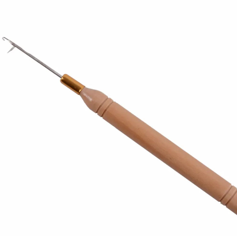 Small hair tool with a wooden handle and metallic end on a white background