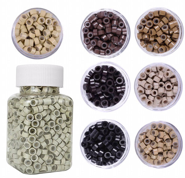 Collection of small plastic beads in various colors in clear containers with a larger container below.