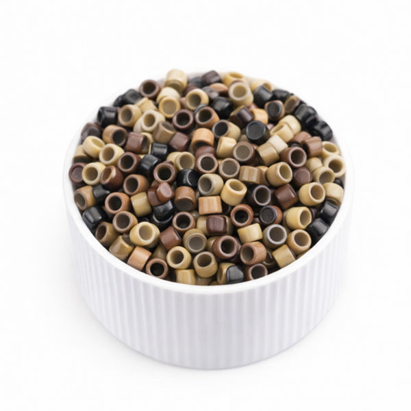 Small 3mm Nano beads for hair extensions in multi-colours in a white bowl  on a white background