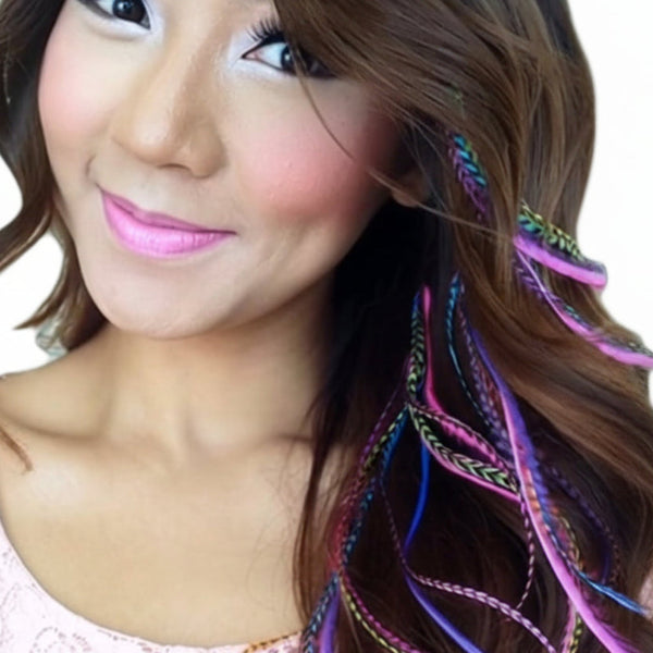 Close-up of a woman with colorful feather hair extensions.