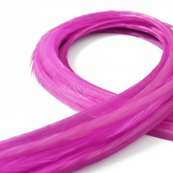 Coiled solid pink feather hair extensions against a white background