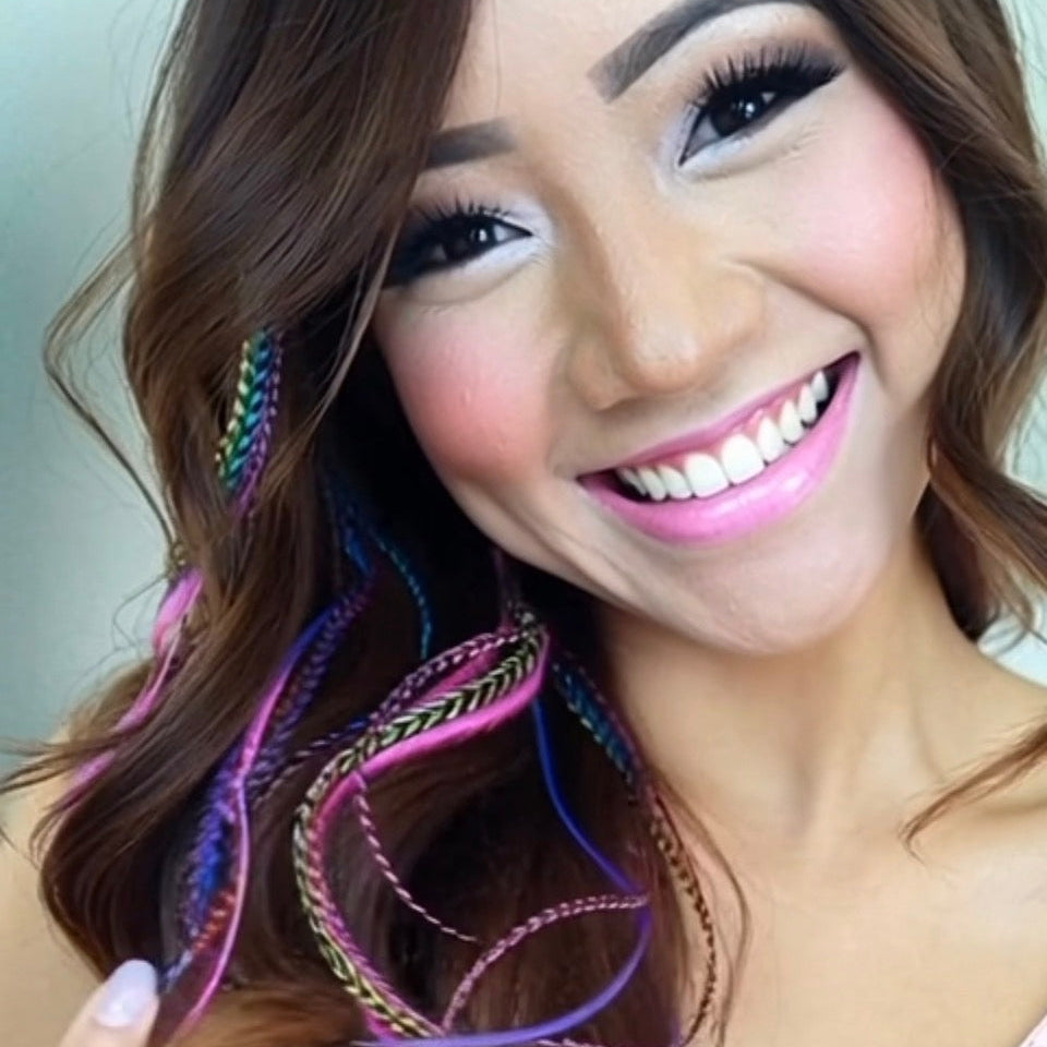 Woman with colorful hair extensions and bright makeup
