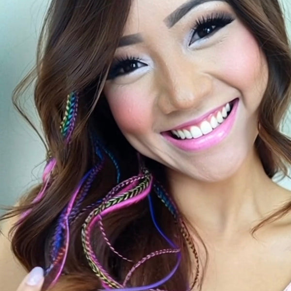 Woman with colorful hair extensions and bright makeup