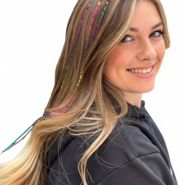 Woman with colorful hair extensions in a salon setting