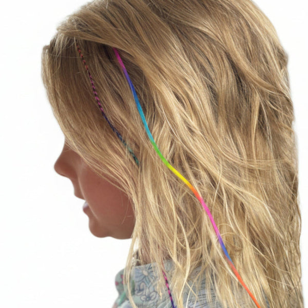 Close-up of a person with colourful rainbow hair extensions in a white background