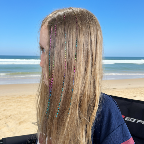 Girl wearing Rainbow Grizzly hair feathers 