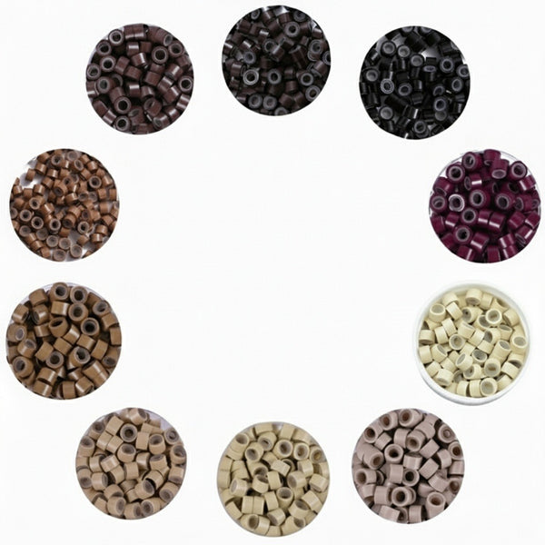 Collection of small cylindrical beads in various colors on a white background