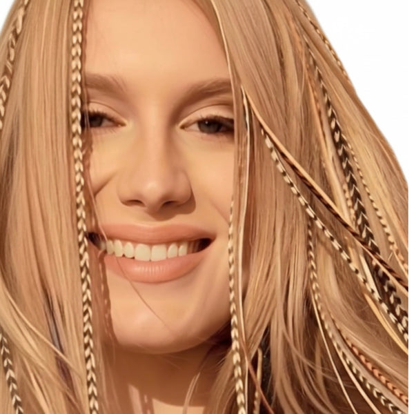 Woman with blonde hair, wearing blonde natural feather hair extensions with real grizzly pattern 