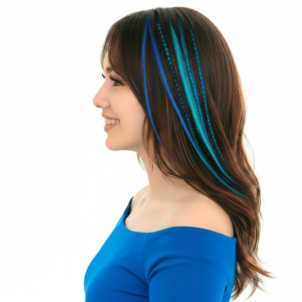 Woman wearing 3 blue shades in XL length feather hair extensions applied in dark hair side view solid and grizzly hair feathers