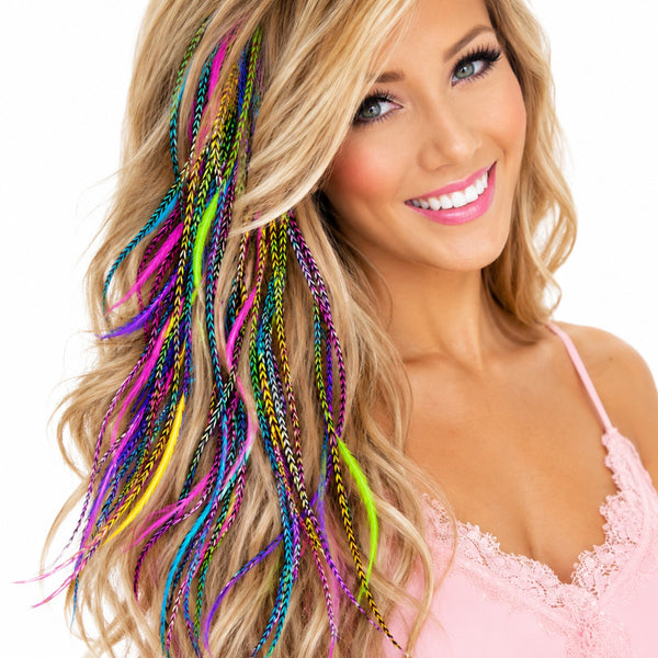 close-up full hairstyle look of colourful grizzly feather hair extensions in blonde boho hairstyle by wild4feathers
