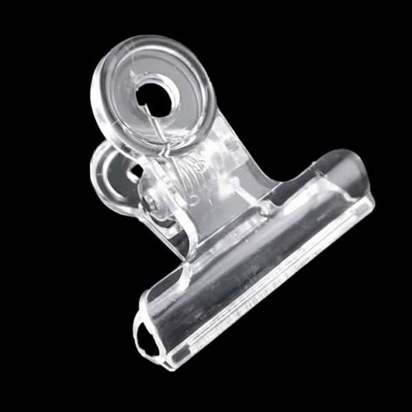 Clear plastic clip on a black background