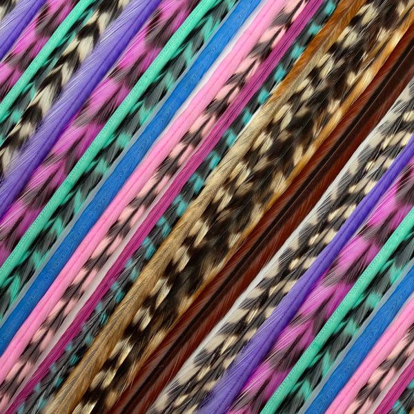 close up of pink purple aqua blues and natural grizzly feather hair extensions in regular width ,real striped feathers for  feather hairstyling