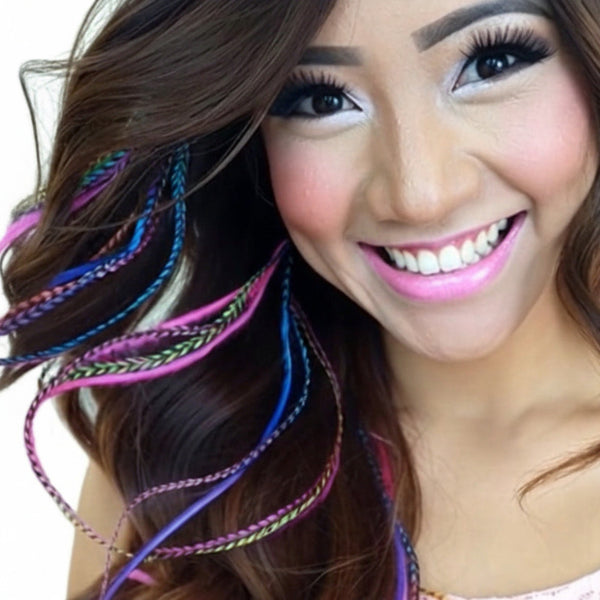 Woman with colourful feather hair extensions in brown hair for feather hairstyling