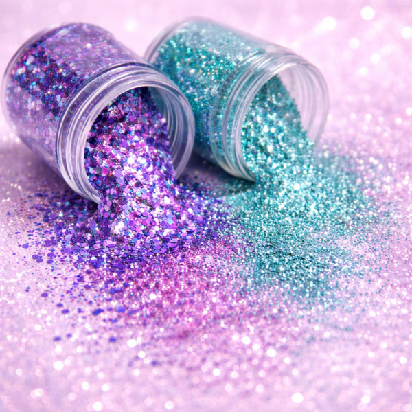 Close up cosmetic glitter texture spill with festival face, body and hair glitter showing sparkle and shine
