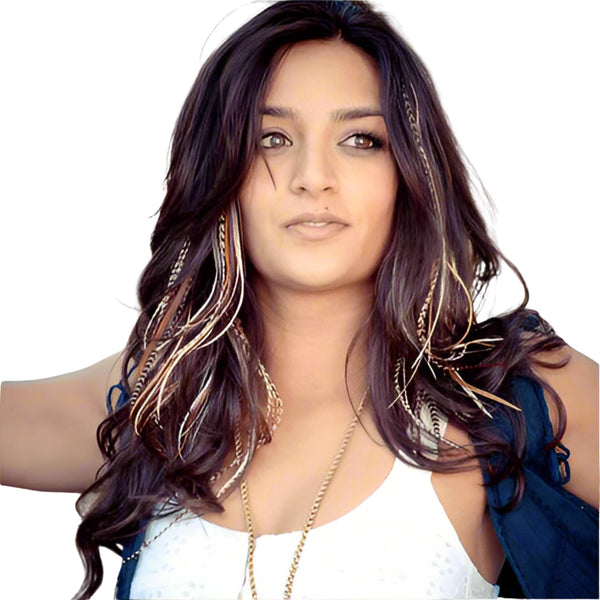 Woman with long, wavy hair wearing a blue top on a white background