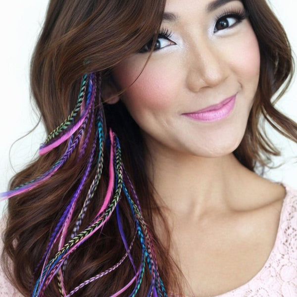 feather hair extensions bright colour mix of real single colour hair feathers in brown hair, of vibrant pink purple blue tones for festival, salon and boho hair styling