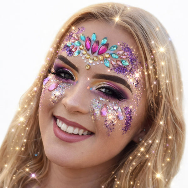 Woman close up of festival cosmetic glitter on face, body and hair glitter showing sparkle and shine featuring colourful face gemstones 