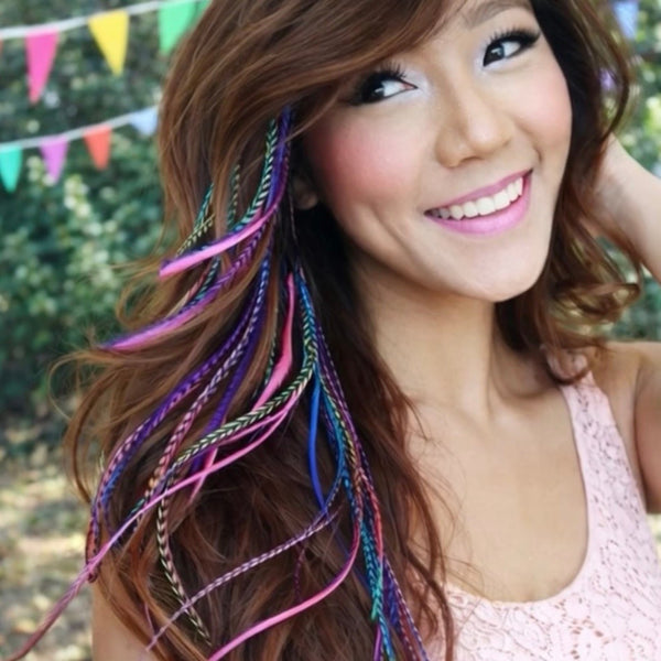 Woman wearing multicolour feather hair extensions bright mix in hair lifestyle outdoor image