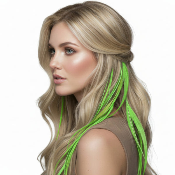 Woman with blonde hair featuring light green solid and grizzly feather hair extensions on a white background