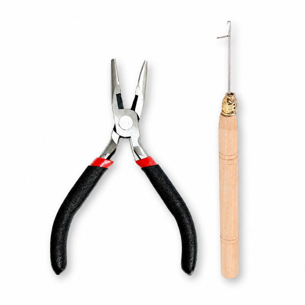 Pair of pliers with black handles and a wooden-handled hook tool for attaching hair extensions