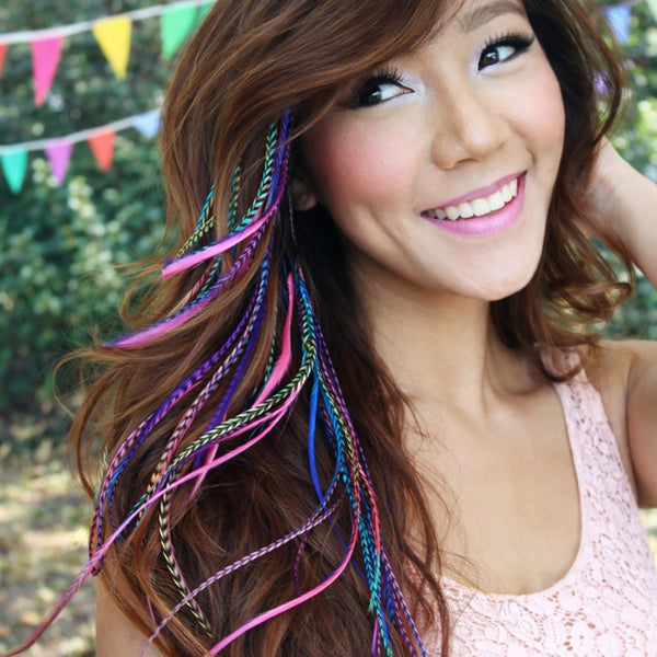 Woman with colourful hair extensions at an outdoor festival