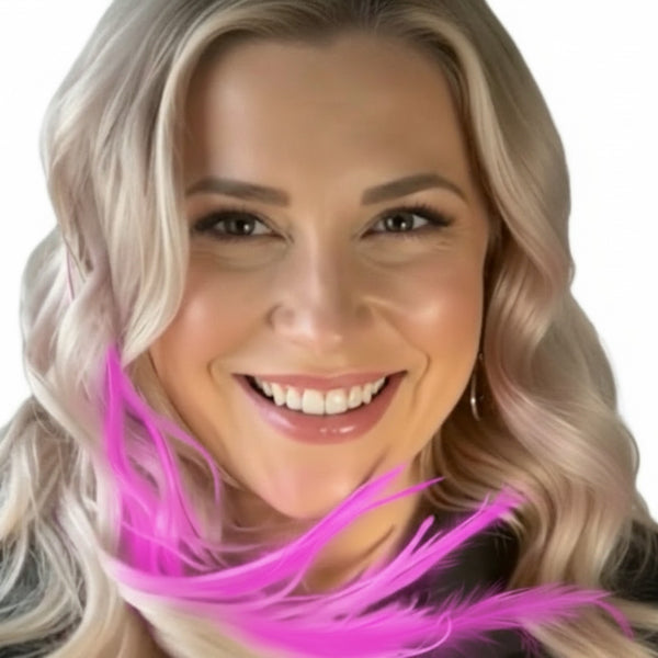 Woman wearing hot pink solid feather hair extensions on white background