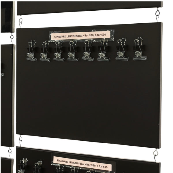 Interlocking small black retail display boards connected together for market stall product displays on a white background
