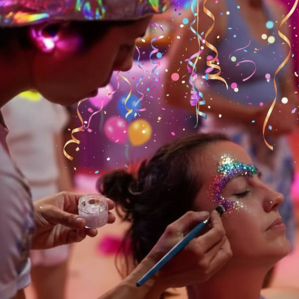Wild4feathers staff applying glitter glam makeup to customer with colorful confetti and balloons at a mobile party