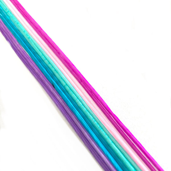 Colorful feather extensions in pink, purple, and blue on a white background