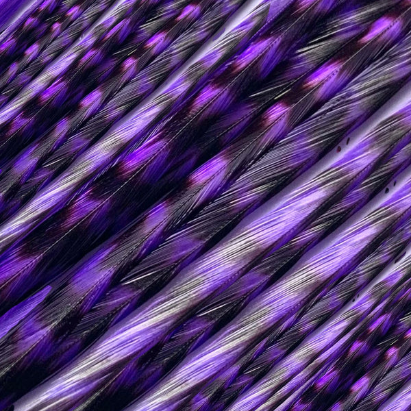 close up of purple grizzly feather hair extensions in regular width ,real grizzly feathers for feather hairstyling