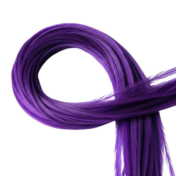 Coiled purple solid hair extensions on a white background