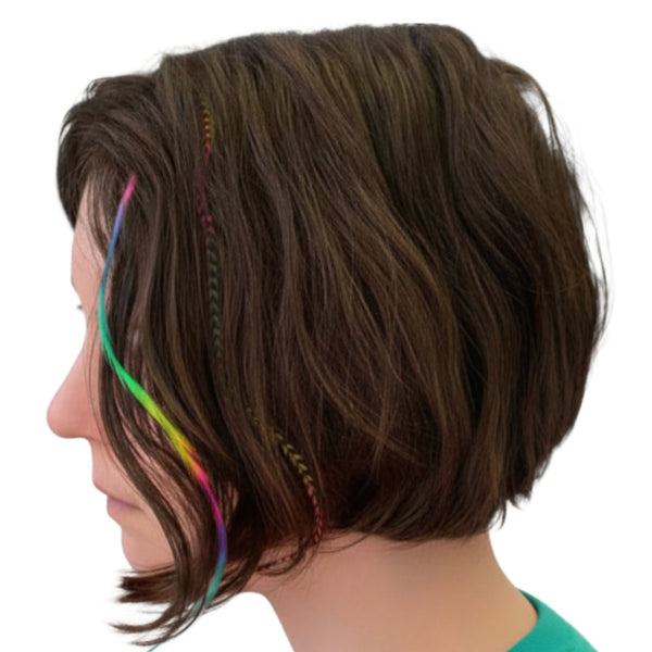 woman with short brown hair featuring colourful rainbow feather extensions on a white background
