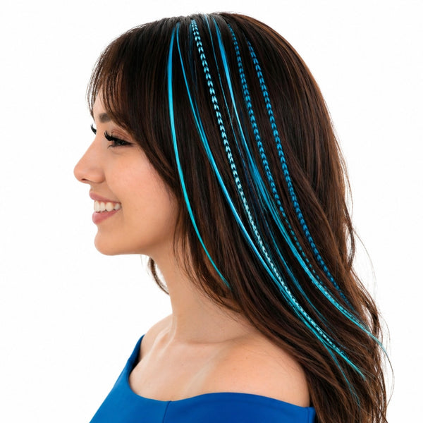 Woman wearing turquoise blue feather hair extensions applied in dark hair side view