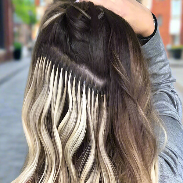 Girl showing off her hair extension attachments 
