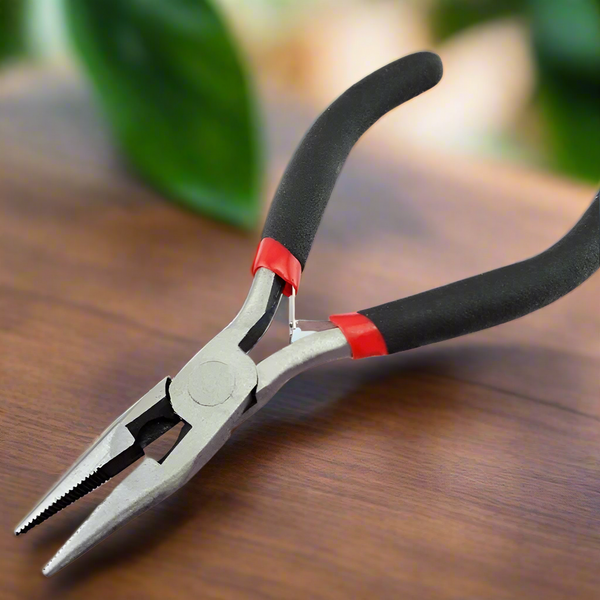 Pair of pliers with black handles and red accents on a white background